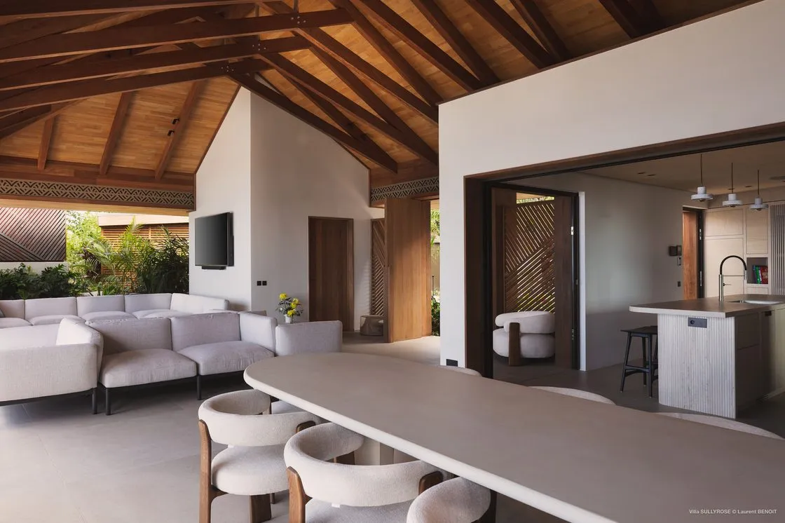Furnished terrace beside a swimming pool at the end of the day