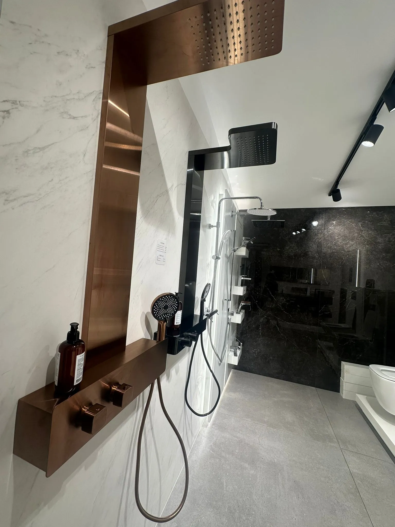 Noken taps displayed on a showroom wall panel